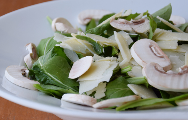 Image of rocket leaves salad with fresh mushrooms and parmesan cheese from Clay's salads menu