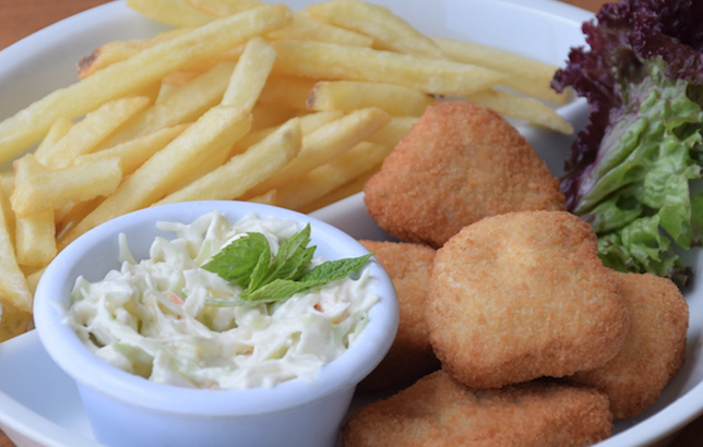 Image of chicken nuggets with fries from Clay restaurant's kids meal section of the menu