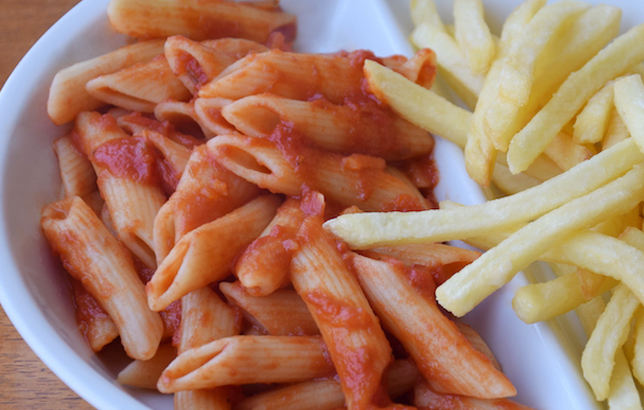 Image of penne pasta and red sauce with fries from Clay restaurant's kids meal section of the menu
