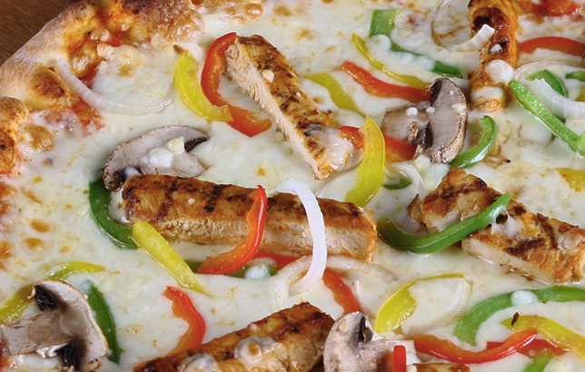 Image of Italian pizza with grilled chicken, peppers, mushrooms, and onions.