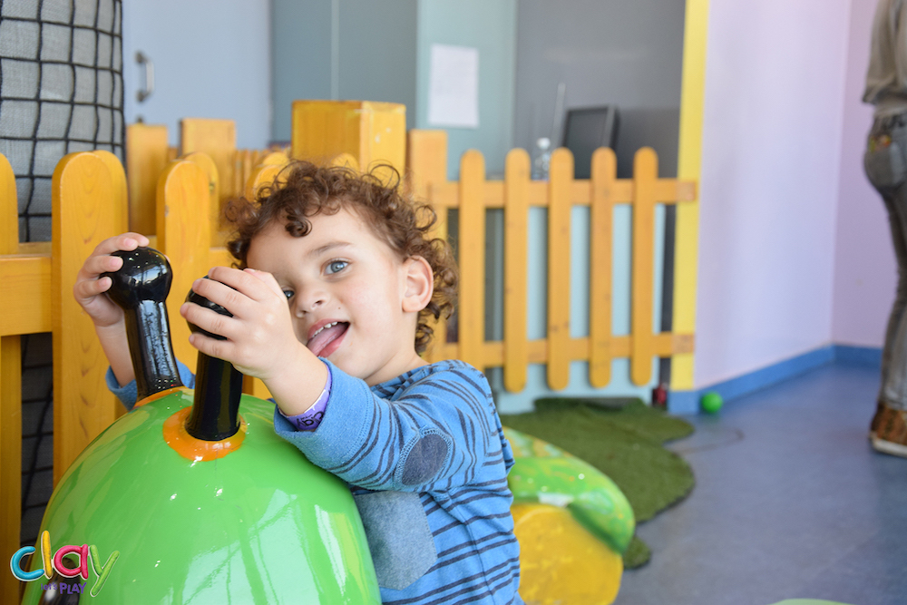 Image of a little boy acting silly at Clay restaurant