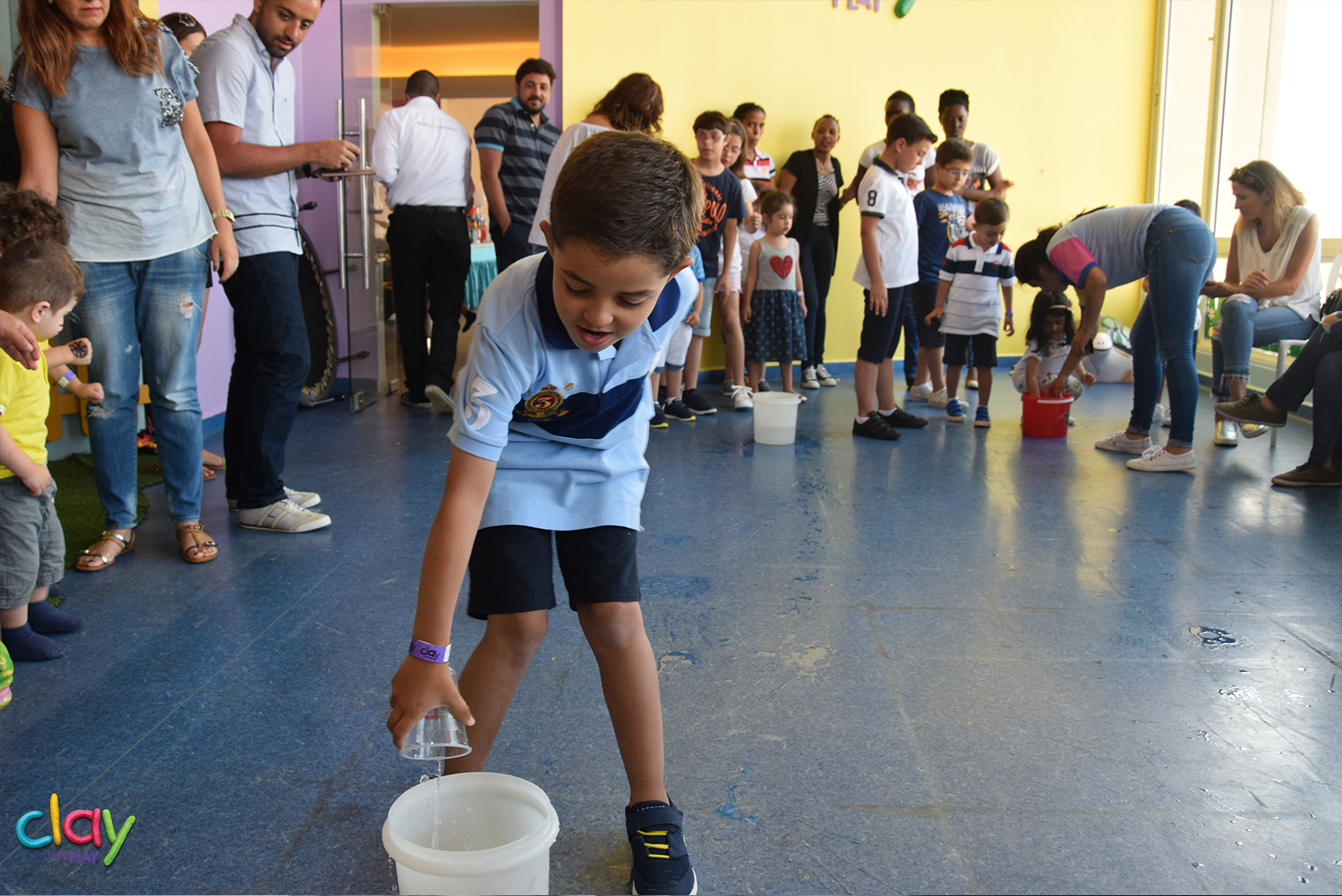 Image of children playing water games as a goodbye summer event